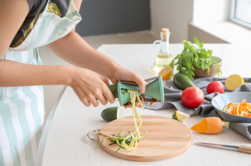 person using spiralizer